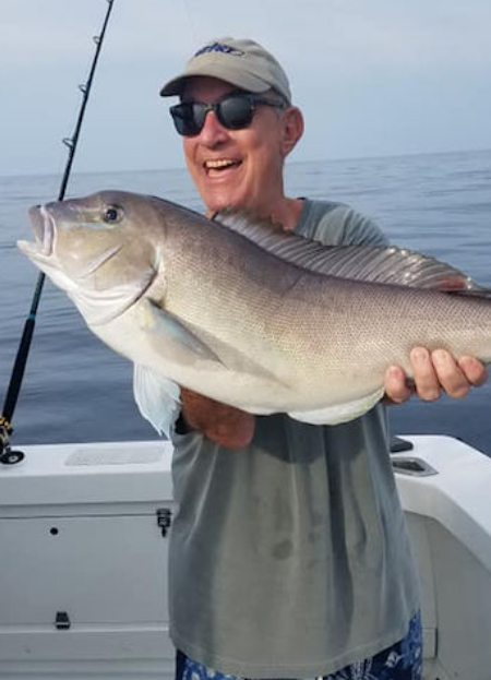 Happy angler holding up big Oregon Inlet Tilefish Happy angler holding up big Oregon Inlet Tilefish