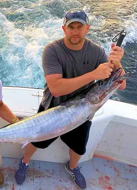 Young Wild Card angler caught this huge OBX wahoo. Young man caught huge wahoo.